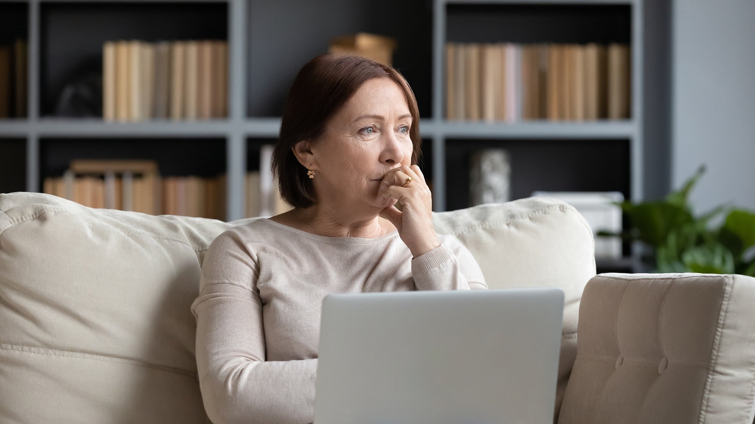 A woman appears worried. If you've wondered, can I use my HSA to buy mastectomy pillows? The short answer is yes. Learn more in our complete guide.