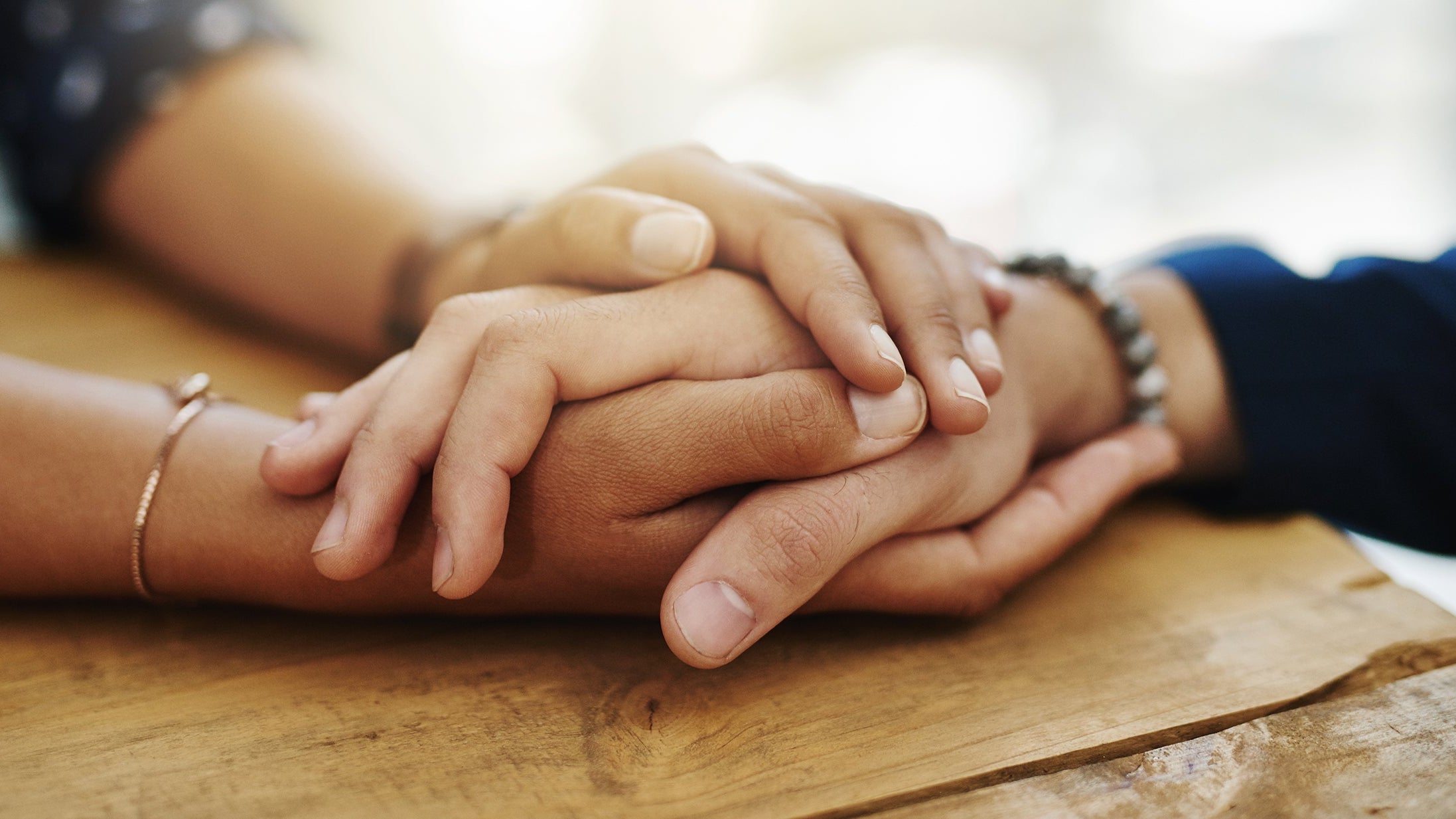Two women hold hands. Discover thoughtful post surgery gifts for her that truly help. From positioning systems to recovery essentials, find gifts that support healing.