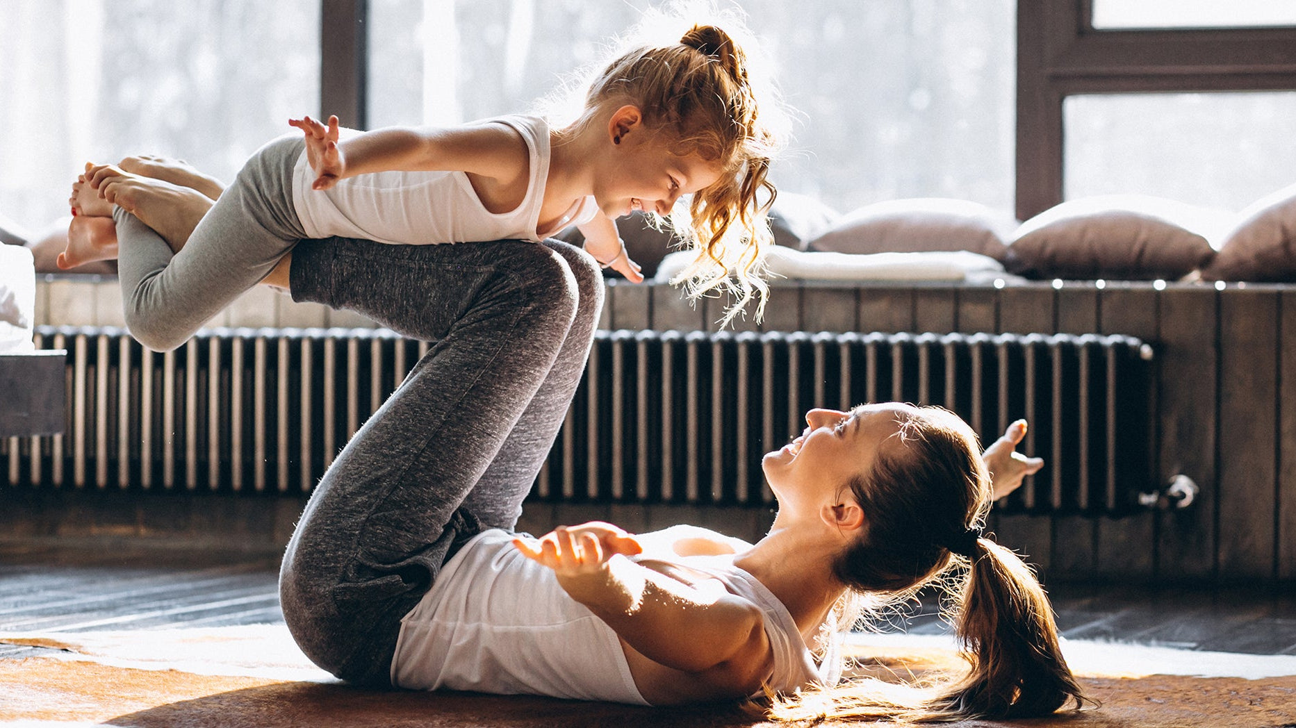 A mom playing with her daughter. Planning a mommy makeover? Get the full recovery checklist: elevated sleep setup, compression garments, wound care, meals, and more to prep before surgery.