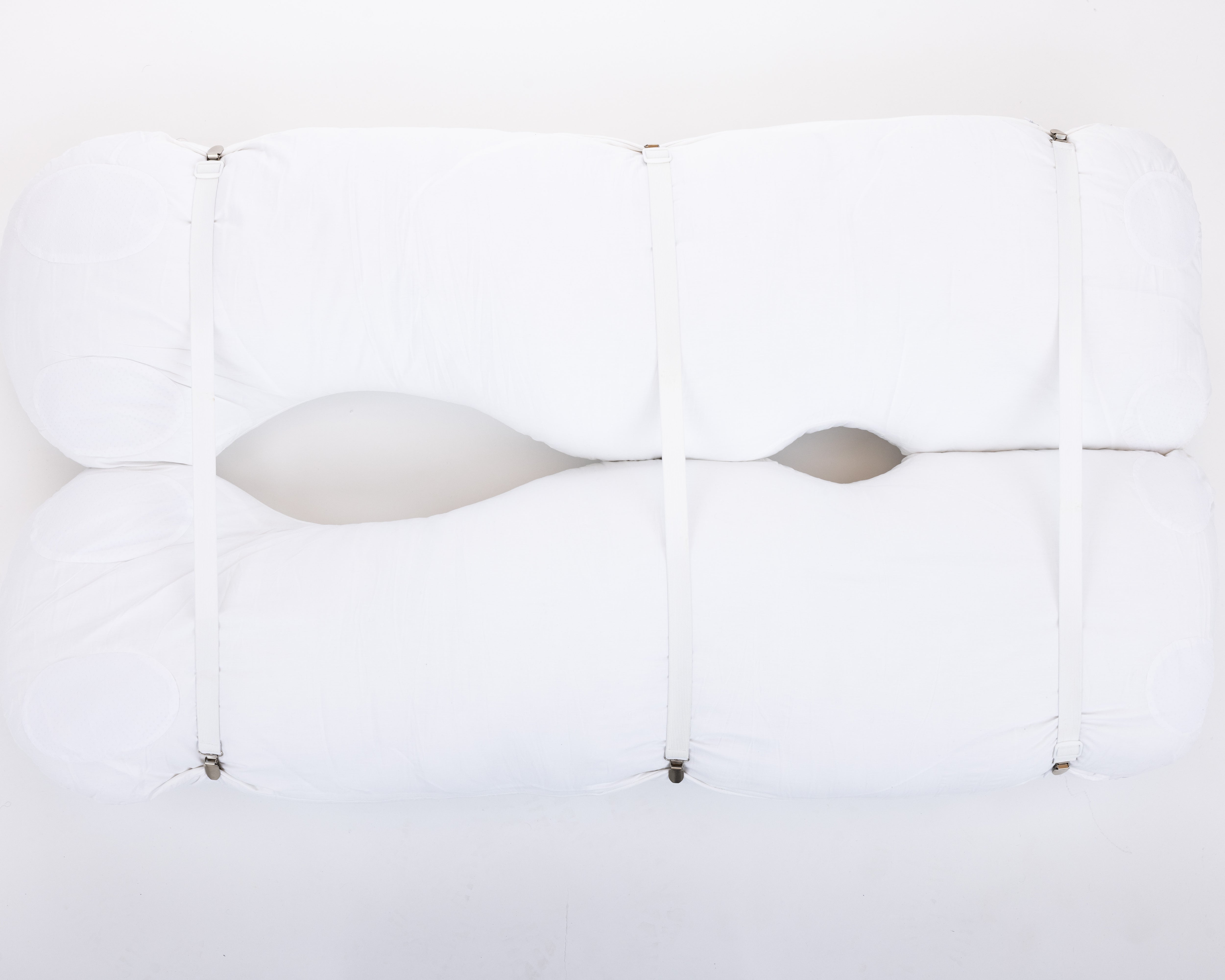 Four white pillow straps with clasps, displayed against a white background, arranged parallel to each other with clasps facing the same direction.