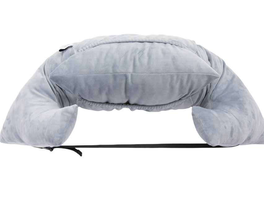 The Chest Pillow is a soft, light gray U-shaped travel pillow with extra top cushioning and a black adjustable strap, shown on a plain white background—perfect as a chest pillow for comfort after breast surgery.