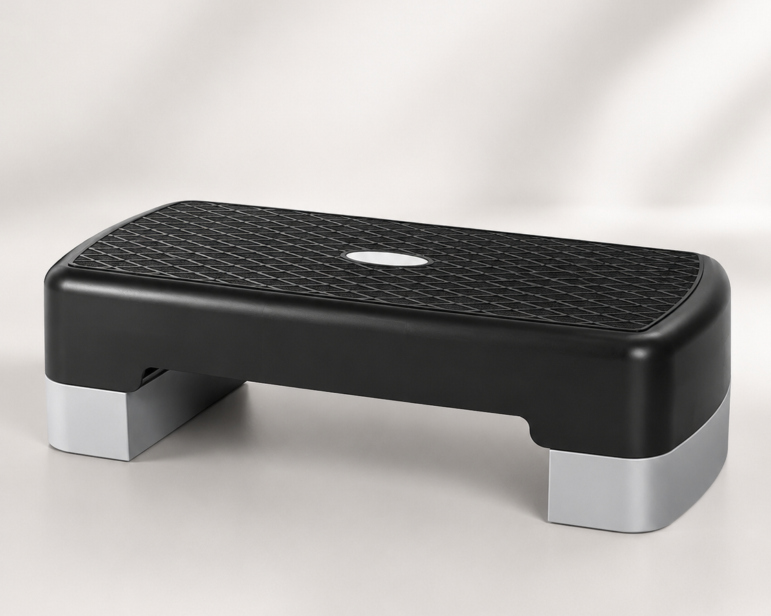A black and gray Bedside Step Stool with a textured, non-slip surface is placed on a light background. This sturdy stool is ideal for fitness and exercise routines.