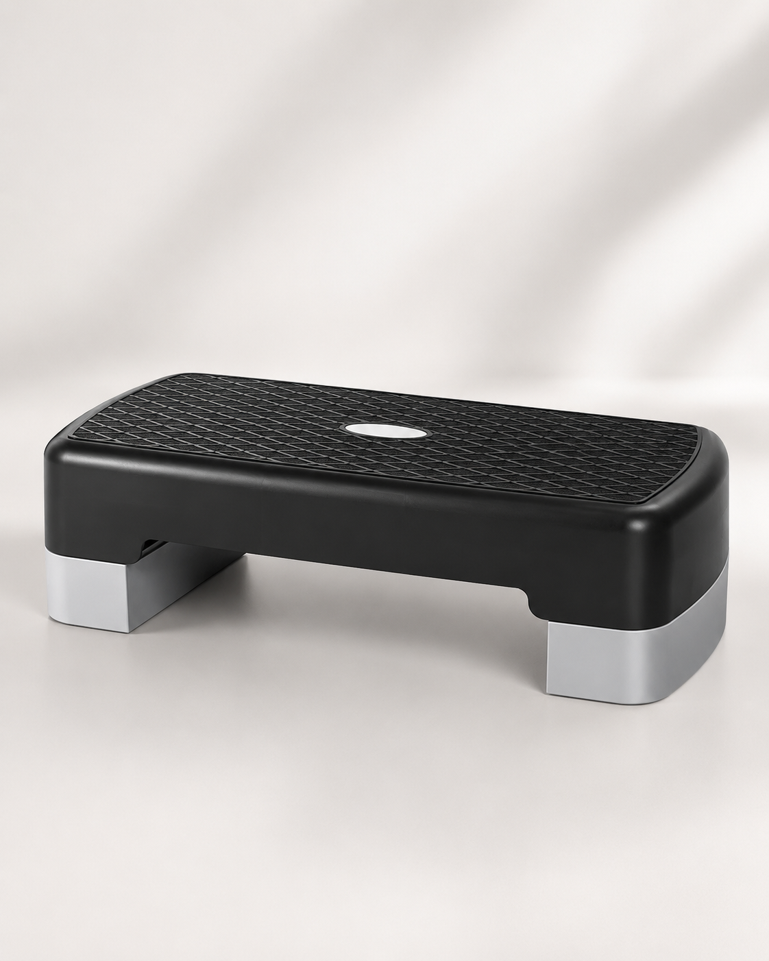 A black and gray Bedside Step Stool with a textured, non-slip surface is placed on a light background. This sturdy stool is ideal for fitness and exercise routines.