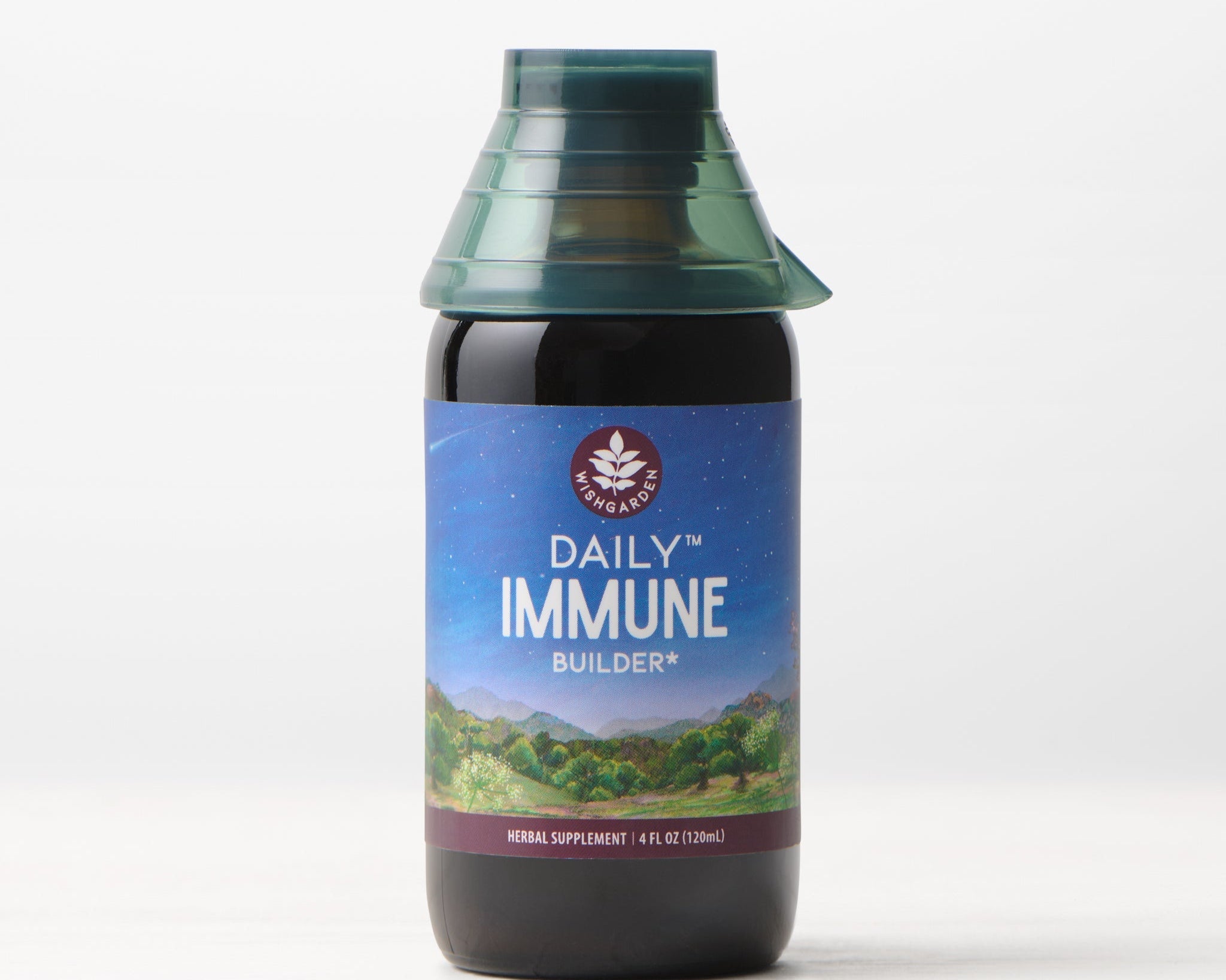 A 4 fl oz (120 ml) bottle of Daily Immune Builder, featuring a green cap and a mountain night sky label, sits on a white surface with a light background—ideal for daily immune support.