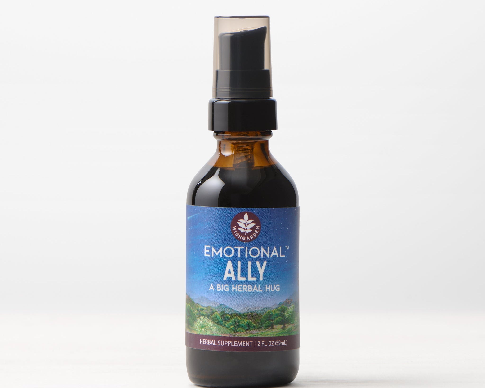 A brown glass bottle with a black spray cap labeled "Emotional Ally: A Big Herbal Hug" rests on a white surface. The label displays a scenic landscape, reflecting its mood and emotional support benefits.