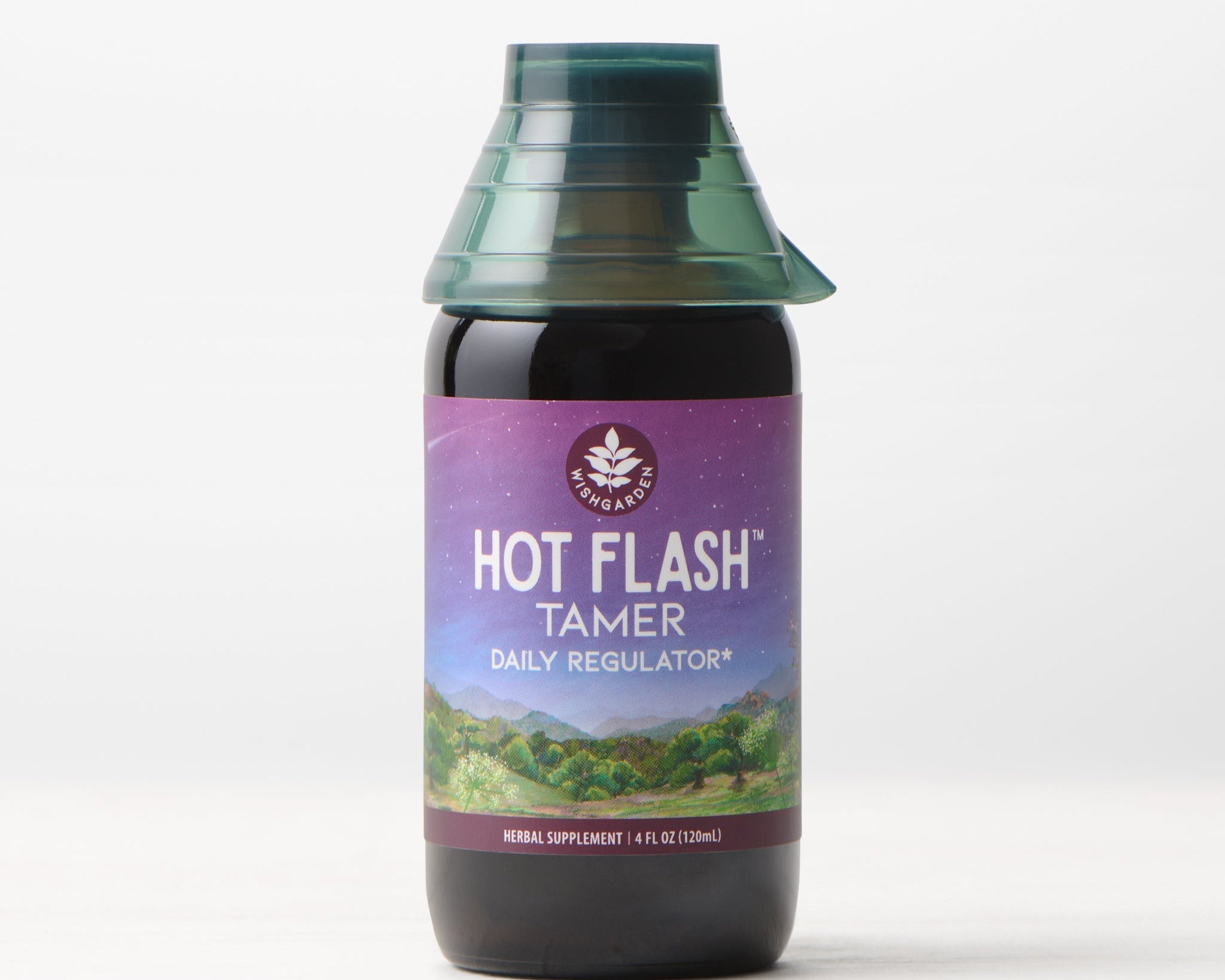 A bottle of Hot Flash Tamer, Daily Regulator herbal supplement for menopause support features a purple label with a landscape illustration, set against a plain white background.