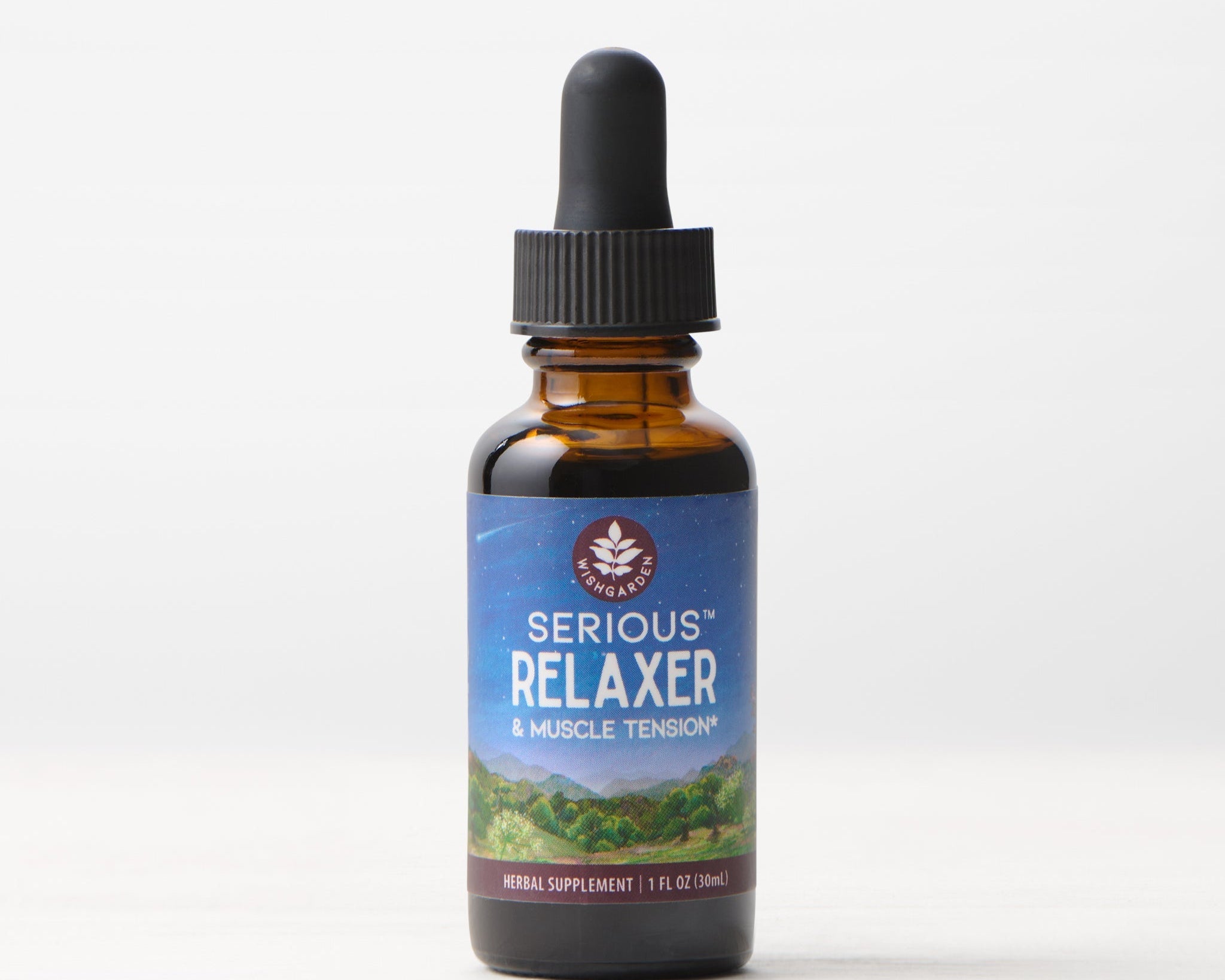 A 1 fl oz brown glass dropper bottle labeled Serious Relaxer & Muscle Tension, with a black cap and blue mountain landscape label—herbal supplement formulated for muscle tension relief and stress support.