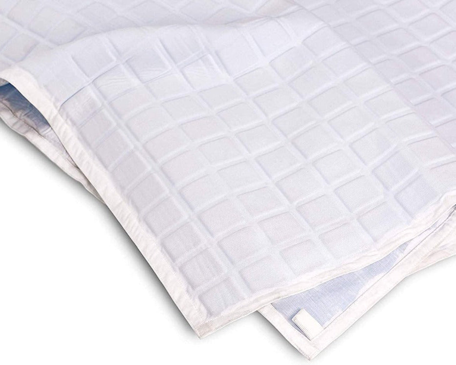 A close-up of the folded Final Sale: Opulence Glacier Blanket | Cooling & Weighted, featuring a subtle square pattern—perfect as a cooling, temperature-regulating weighted blanket for adults.