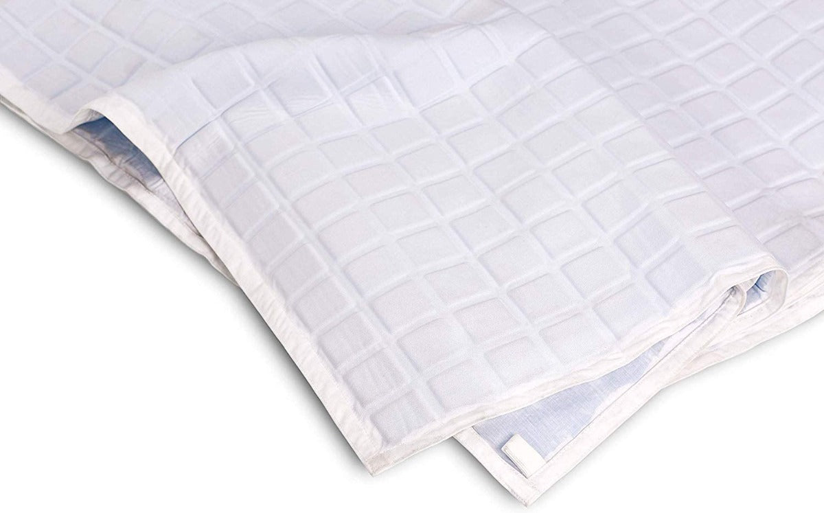 A close-up of the folded Final Sale: Opulence Glacier Blanket | Cooling & Weighted, featuring a subtle square pattern—perfect as a cooling, temperature-regulating weighted blanket for adults.