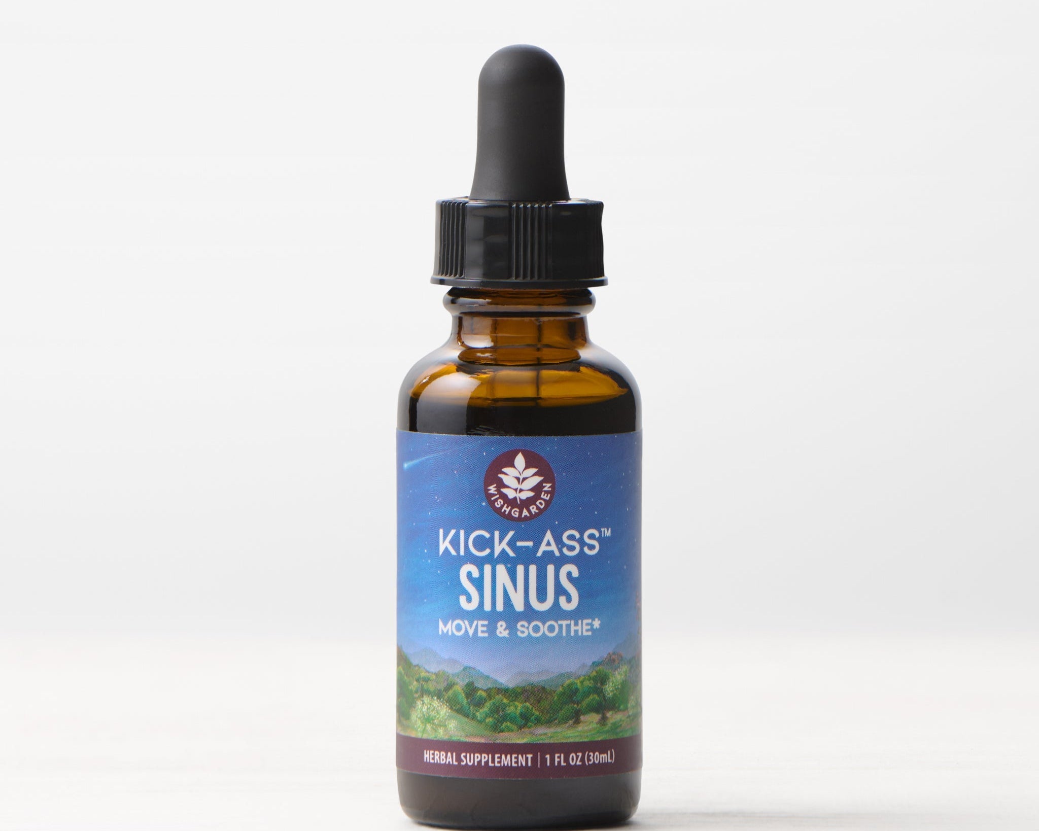 A 1 fl oz (30 ml) amber glass dropper bottle of Kick-Ass Sinus, Move & Soothe herbal supplement rests on a light surface with a white background—an herbal remedy for upper respiratory support.