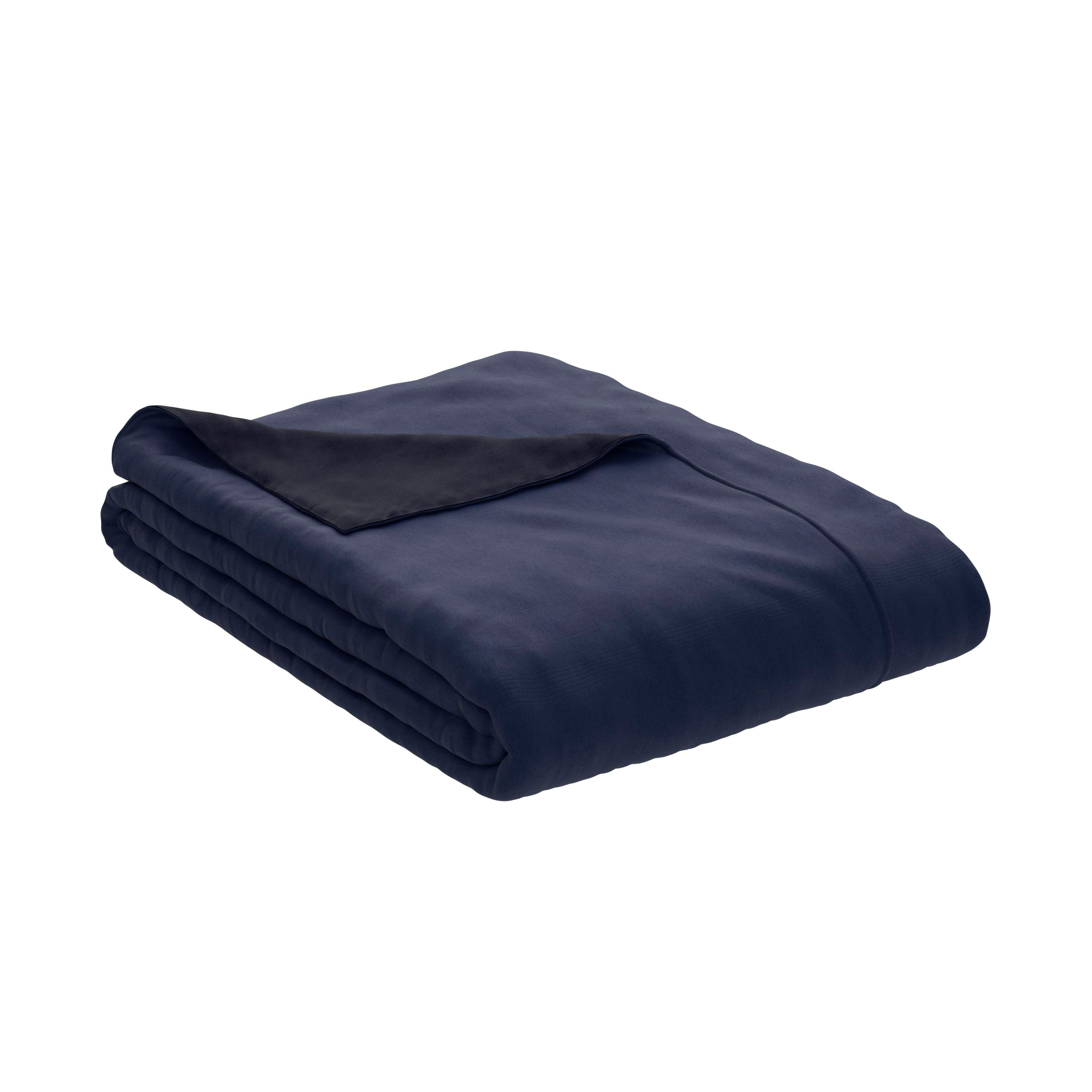 The PureCare Duvet Cover | Cooling Bamboo in dark blue is neatly folded with a corner turned to reveal its black underside and dual-sided design, all displayed on a white background.