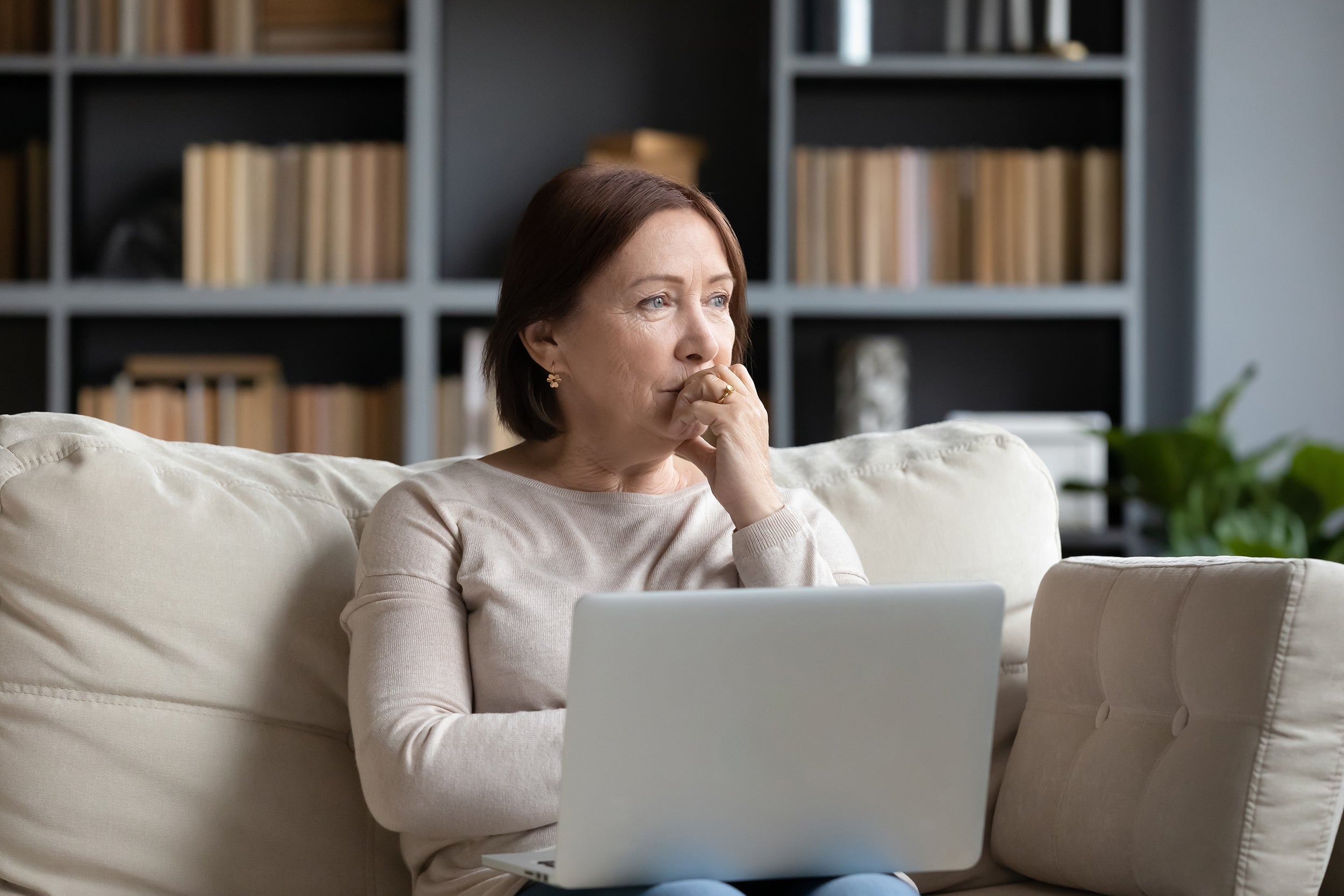 A woman appears worried. If you've wondered, can I use my HSA to buy mastectomy pillows? The short answer is yes. Learn more in our complete guide.
