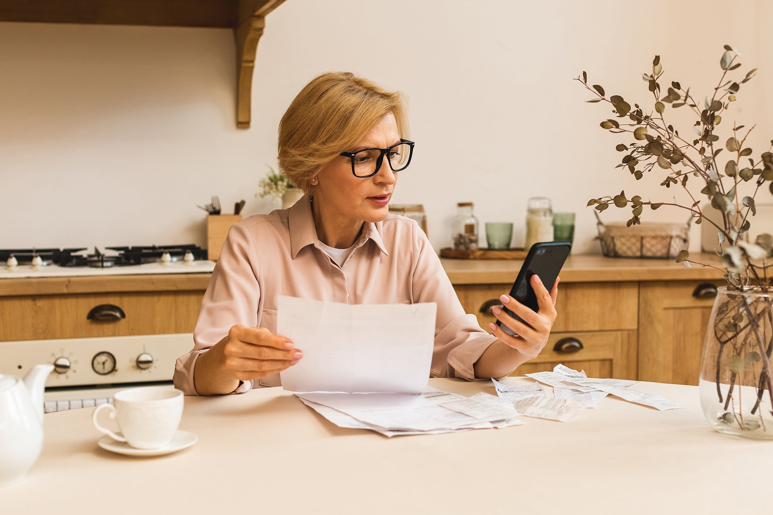 A woman reviews finances. Use FSA or HSA funds for post-surgical recovery equipment before surgery. Smart pre-op planning ensures better healing, tax savings, and optimal positioning from day one.