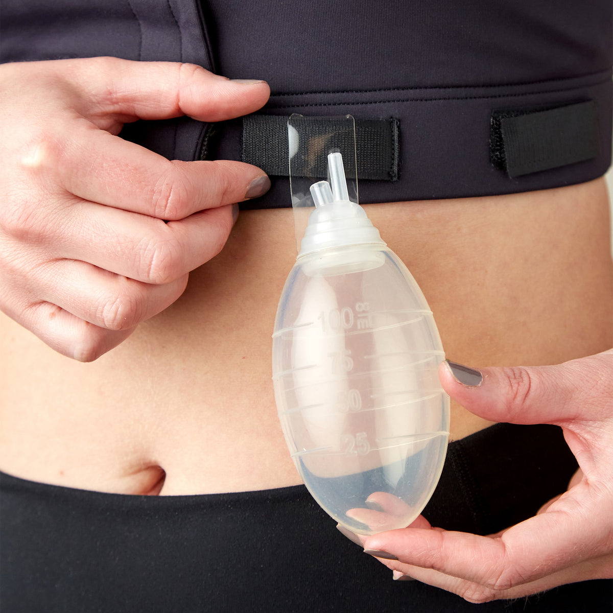 A detail of the post surgical drain bulb for the Larissa bra. Not sure how to sleep with surgical drains after a mastectomy? Read more in our complete guide.