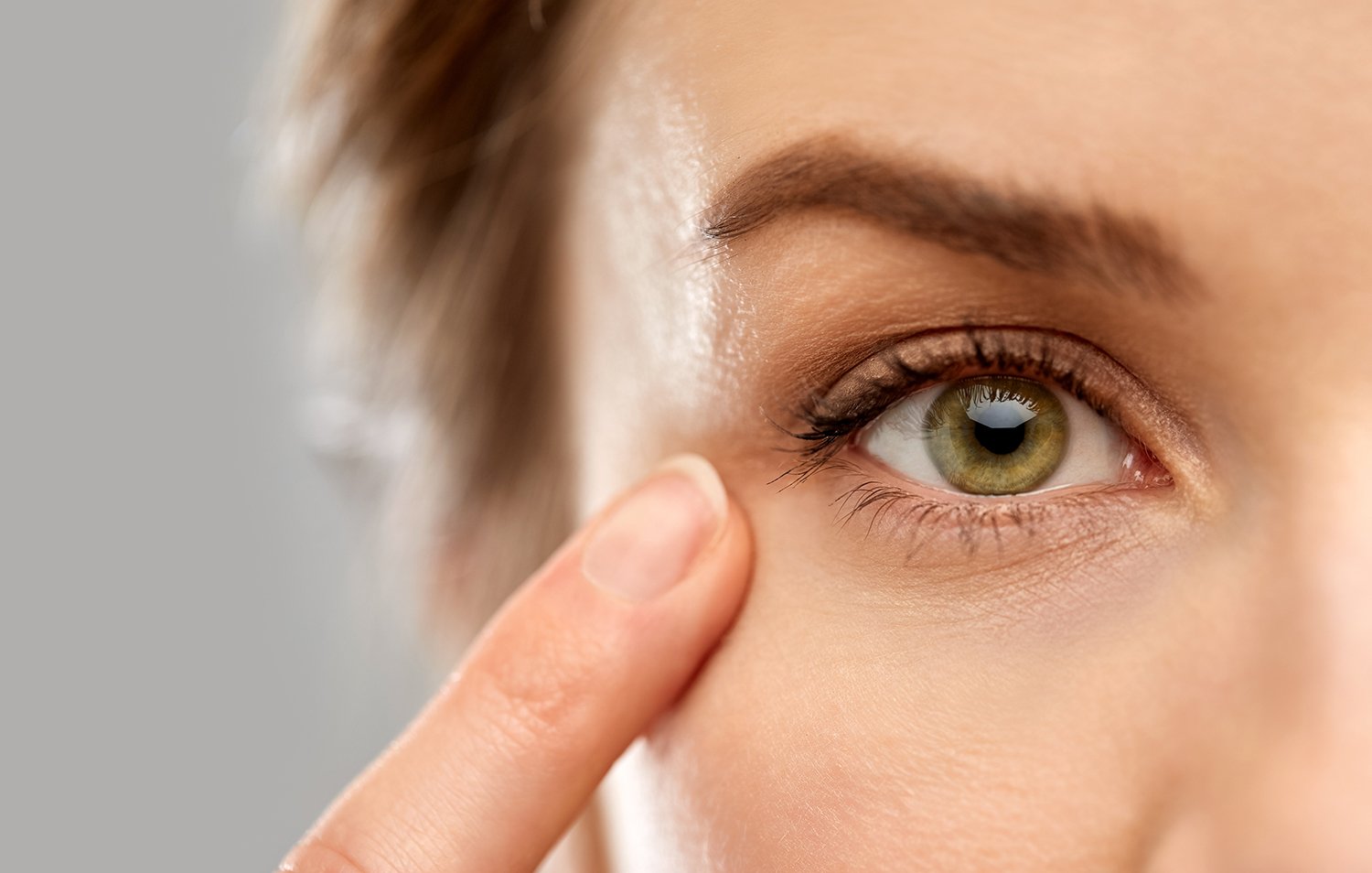 A detail photo of a woman's eye. Back sleeping is the ideal sleep position after cataract surgery, and the Sleep Again Pillow System can help by preventing rolling in the night.