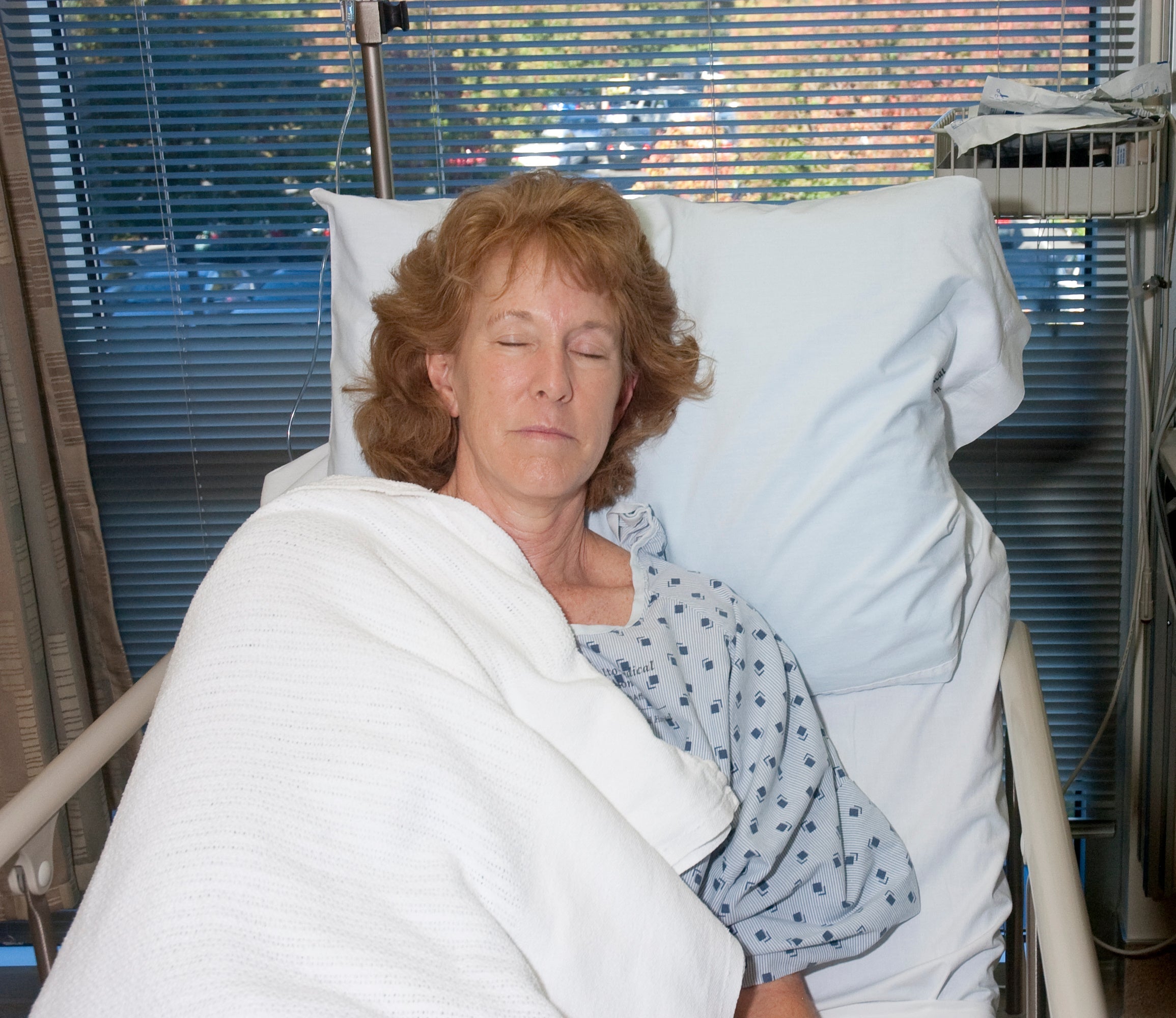 Woman sleeping  at an elevated angle  after surgery.