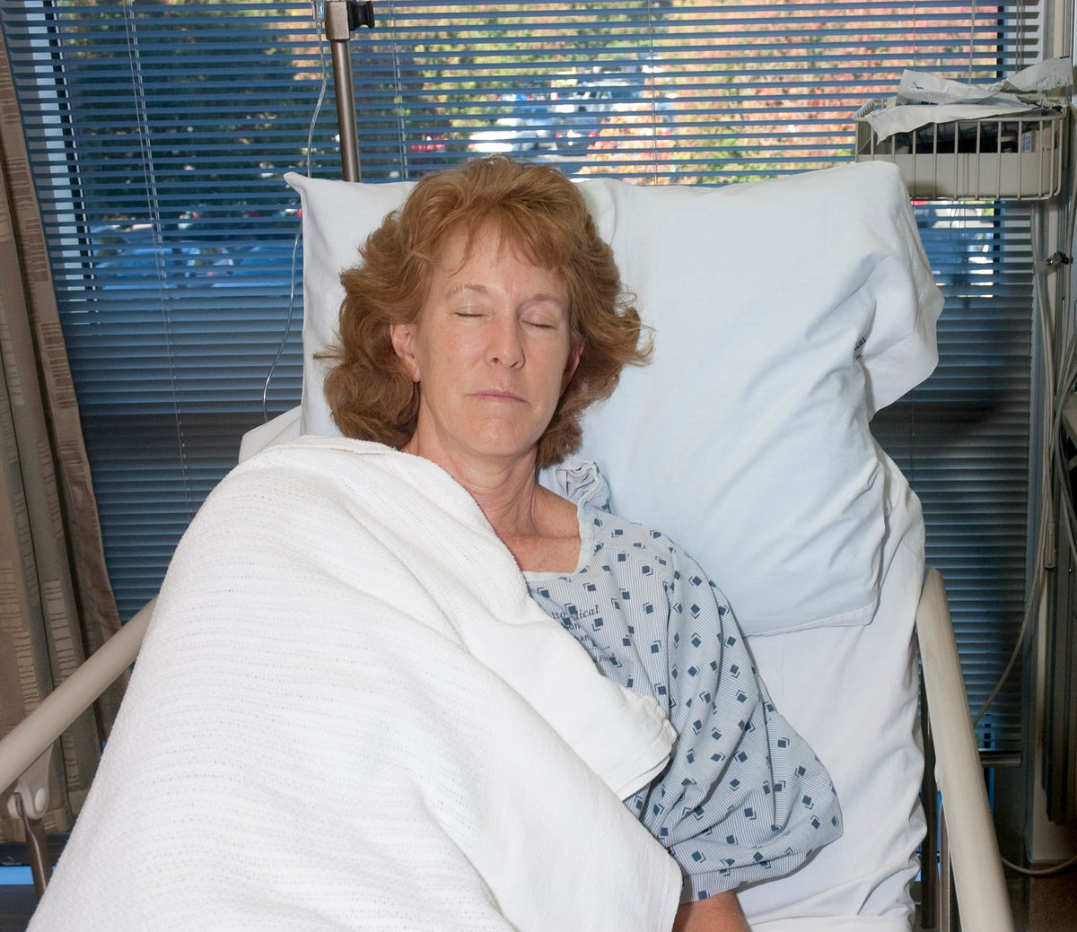 Woman sleeping  at an elevated angle  after surgery.