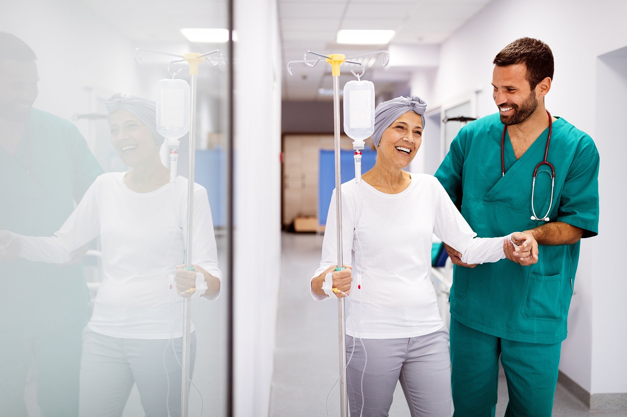 A woman walking with her doctor in a hospital. Planning ahead for cancer surgery recovery can ease the stress. Learn what to expect, common side effects, and how to prepare your home well before surgery