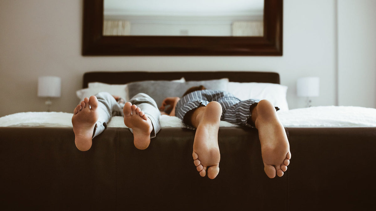 Two people sleeping in different positions. Back, side, stomach, or elevated—every sleep position affects your spine, breathing, and comfort differently. Compare the real pros and cons of each.
