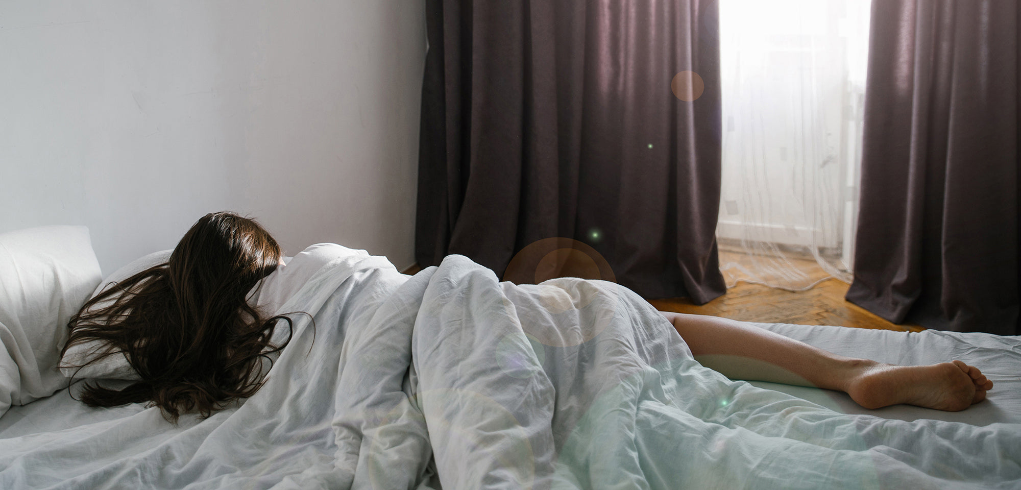 A woman sleeping on her side. Facelift recovery sleep guide: when side sleeping is safe again, why elevation matters for swelling, and how to set up positioning before your surgery day.