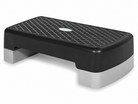 The Bedside Step Stool is a black and gray aerobic step platform featuring a textured, non-slip surface, perfect for fitness and exercise routines—and its versatile design allows it to double as a sturdy bedside step stool, offering enhanced safety and convenience.