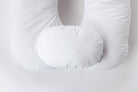 Two white, oval-shaped side pillows from "Two Side Pillows Sold Separately" are displayed atop a contoured body pillow with a washable slipcover, all arranged against a plain white background.