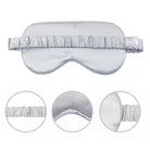 The Mulberry Silk Sleep Eye Mask with Silk Covered Elastic Strap is pictured in silver. Three circular insets show the strap, soft inner lining, and mask edge. A fabric care label is attached to this luxurious blackout mask’s strap.