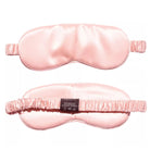 Two light pink Mulberry Silk Sleep Eye Masks are displayed—one shows the smooth front, the other highlights the silk-covered elastic strap and care label, emphasizing the mask’s elegant design and luxurious material.