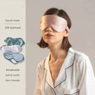 A woman in white pajamas wears a pale pink Mulberry Silk Sleep Eye Mask with Silk Covered Elastic Strap, standing against a neutral background. Eye masks in various colors are displayed nearby, with text noting their soft, breathable qualities.