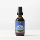 A 2 fl oz brown glass spray bottle of Daily Immune Builder herbal supplement with a blue and green label, leaf logo, and nature scene emphasizing daily immune support, displayed on a plain white background.