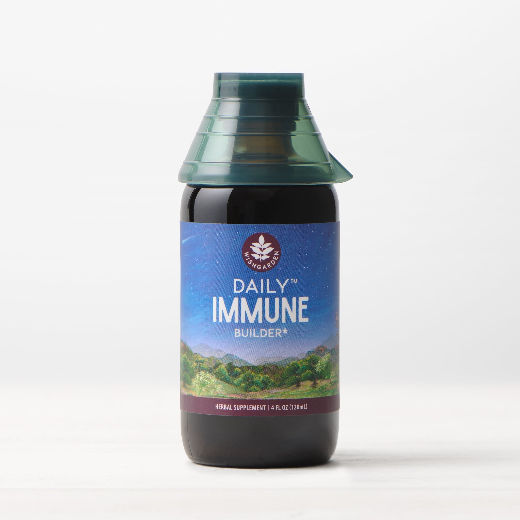 A 4 fl oz (120 ml) bottle of Daily Immune Builder, featuring a green cap and a mountain night sky label, sits on a white surface with a light background—ideal for daily immune support.