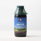 A 4 fl oz (120 ml) bottle of Daily Immune Builder, featuring a green cap and a mountain night sky label, sits on a white surface with a light background—ideal for daily immune support.