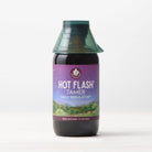 A bottle of Hot Flash Tamer, Daily Regulator herbal supplement for menopause support features a purple label with a landscape illustration, set against a plain white background.