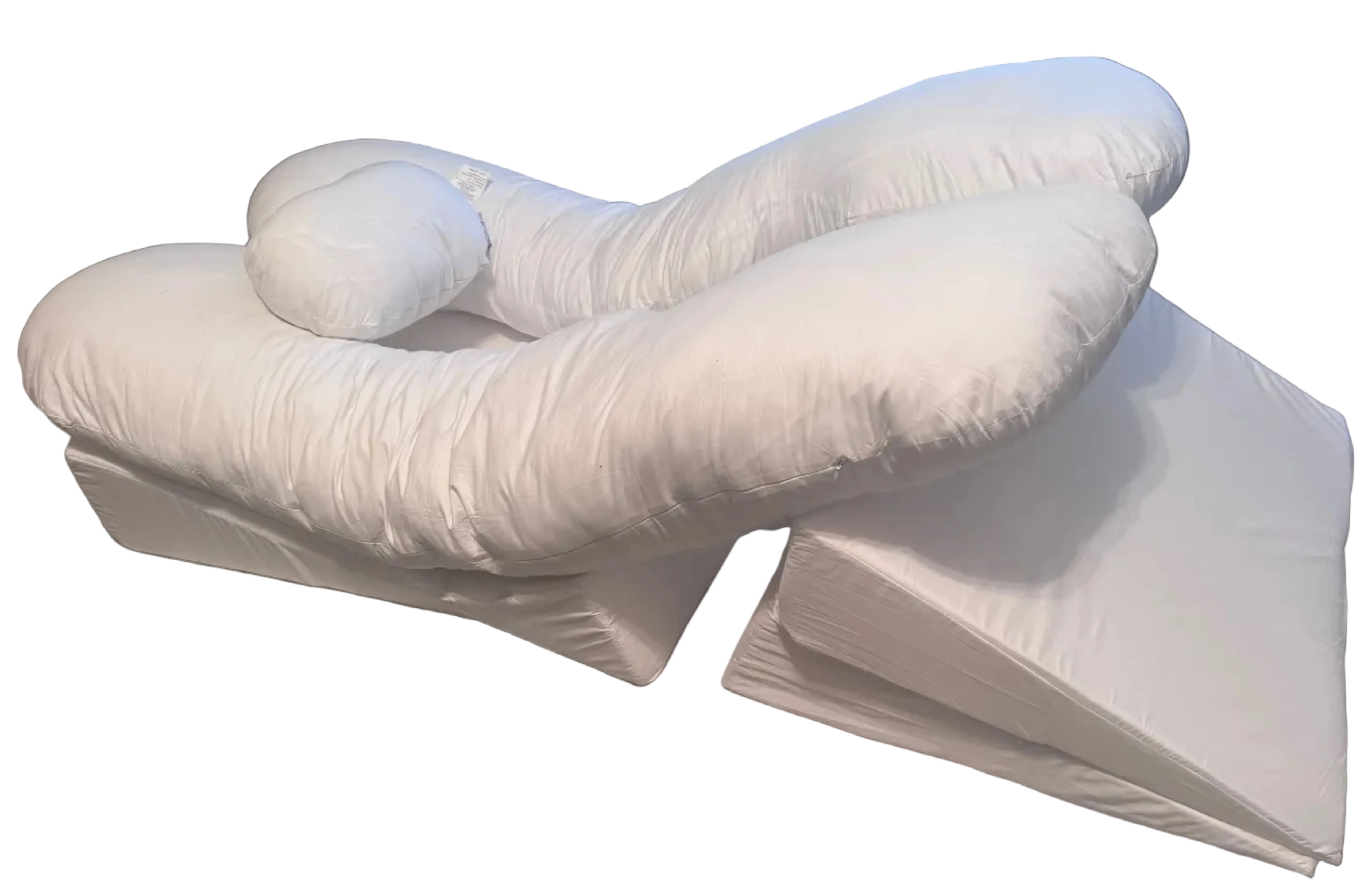 The BBL Add On Set includes a white U-shaped body pillow with an attached cylindrical neck pillow, placed atop two wedge-shaped cushions. All pieces are covered in soft white fabric—ideal for BBL recovery.