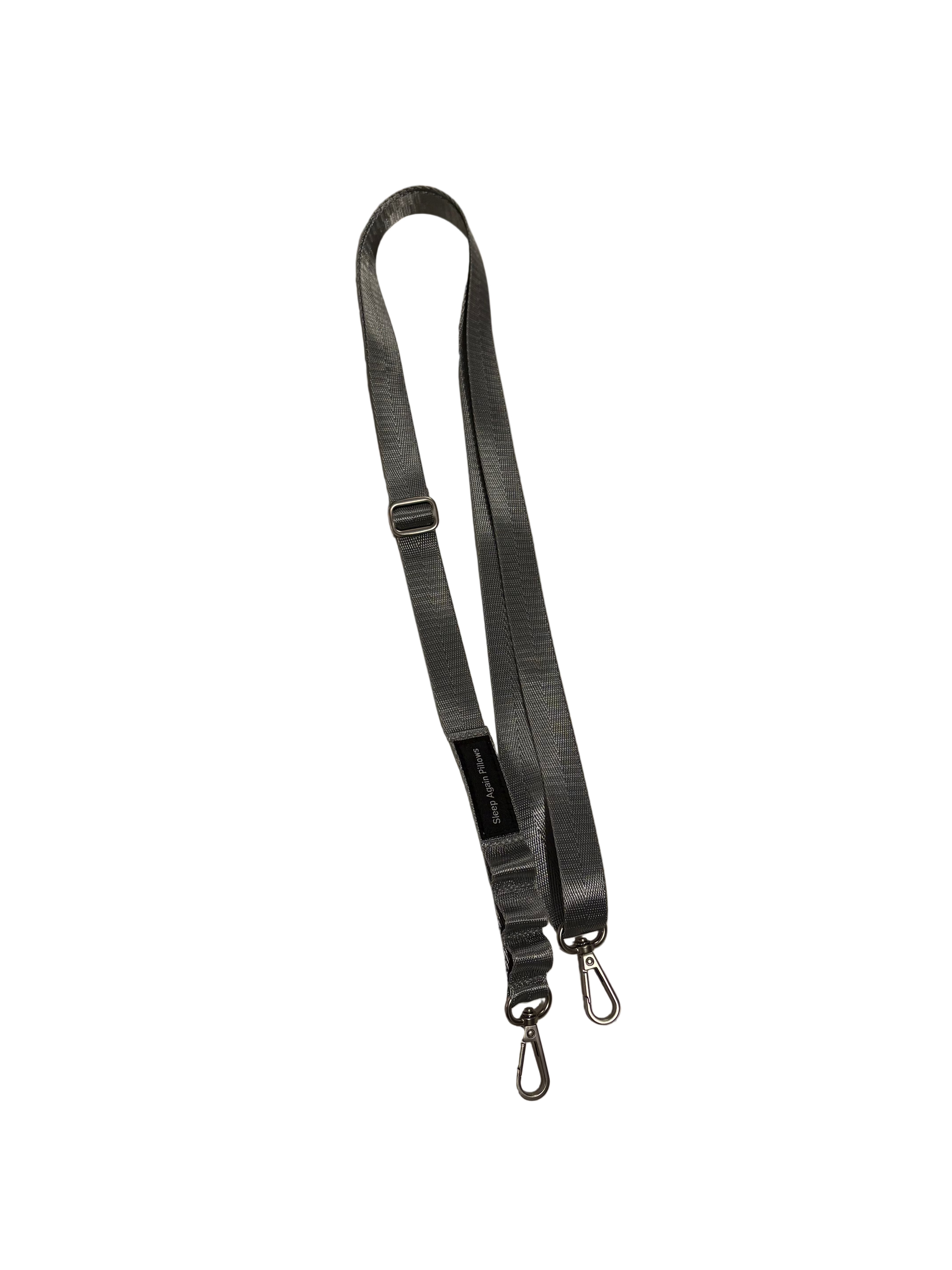 The Sleep Again Surgical Drain Holder features a black adjustable shoulder strap with metal swivel clasps on both ends, designed for easy attachment to a bag, case, or drain holder and shown against a white background.
