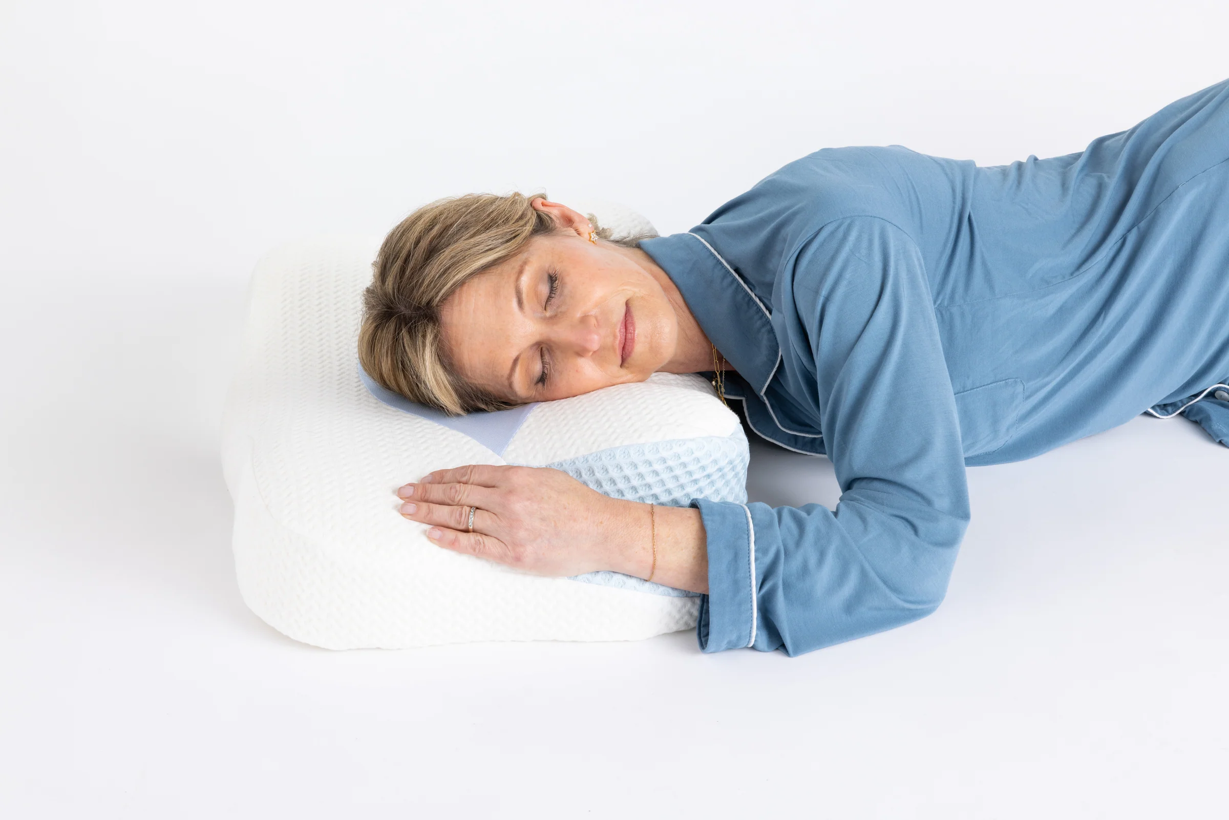 Kate Devlin, co-founder of Sleep Again Pillows, demonstrates how to use the cervical head pillow, one of many post surgical and healing pillows available for better sleep and healing.