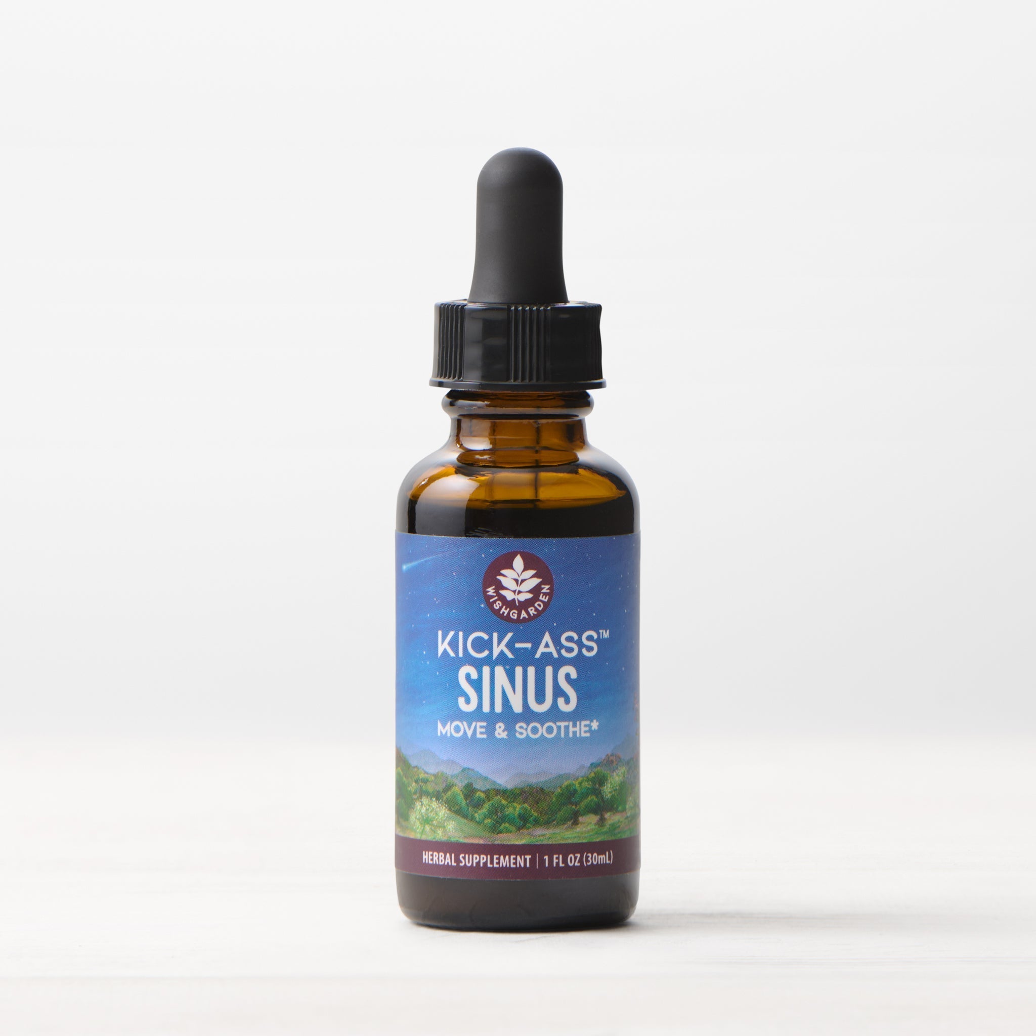 A 1 fl oz (30 ml) amber glass dropper bottle of Kick-Ass Sinus, Move & Soothe herbal supplement rests on a light surface with a white background—an herbal remedy for upper respiratory support.