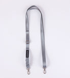 The Sleep Again Surgical Drain Holder is a gray adjustable lanyard with two metal swivel clasp hooks, designed for post-operative drain management and shown laid flat on a white background.